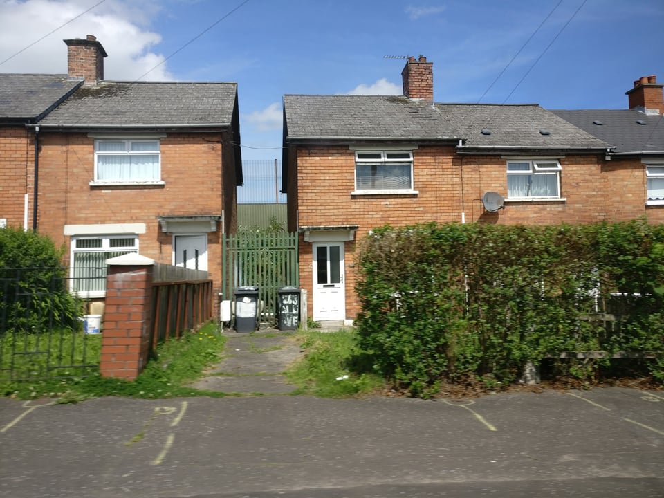 Belfast, where Catholic and Protestant areas are divided by “peace walls”, and streets are gated with curfews