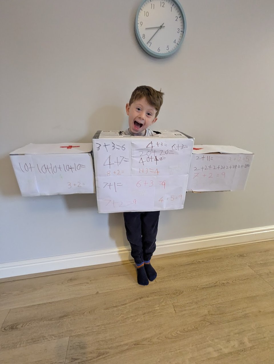 The face of a child who knows  exactly  how much attention this costume is going to get him